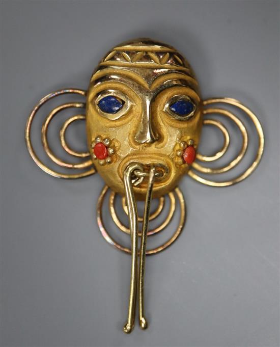 A modern 18k yellow metal and gem set African? mask pendant, overall 4cm,